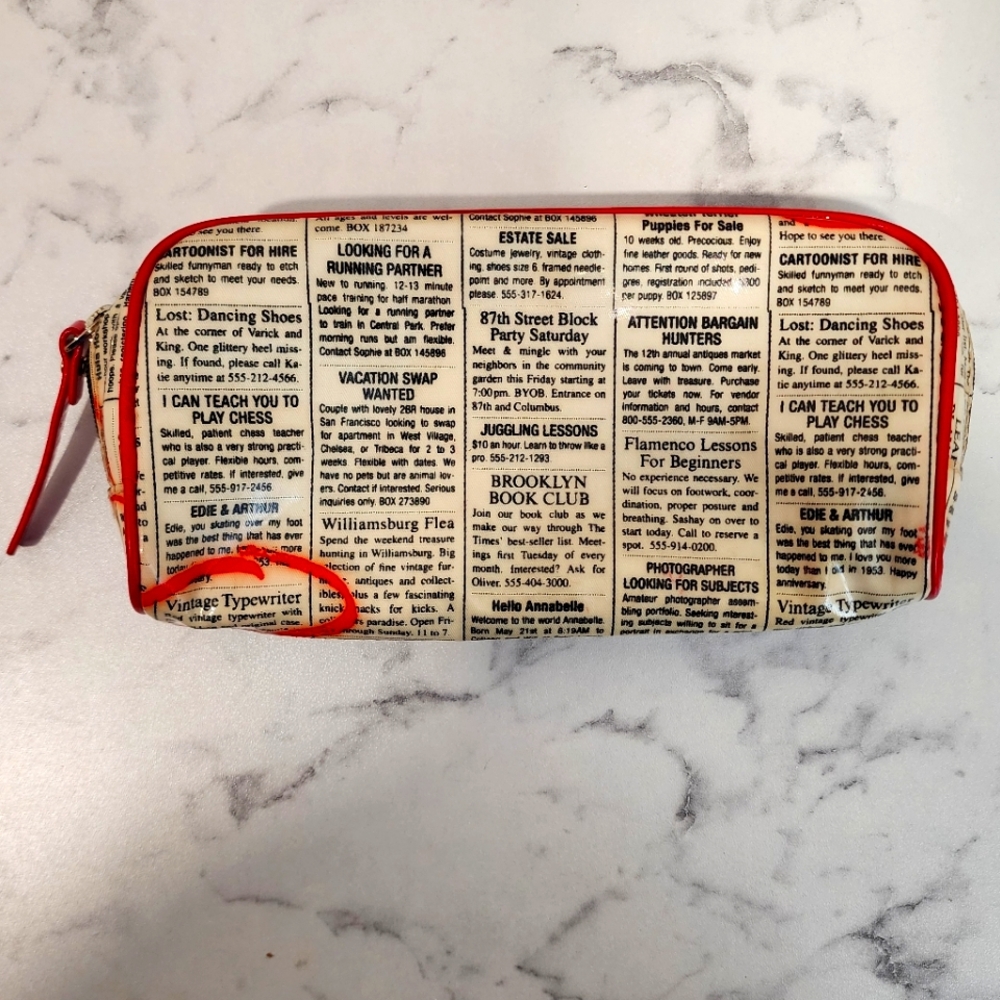 Kate Spade newsprint purse pouch
